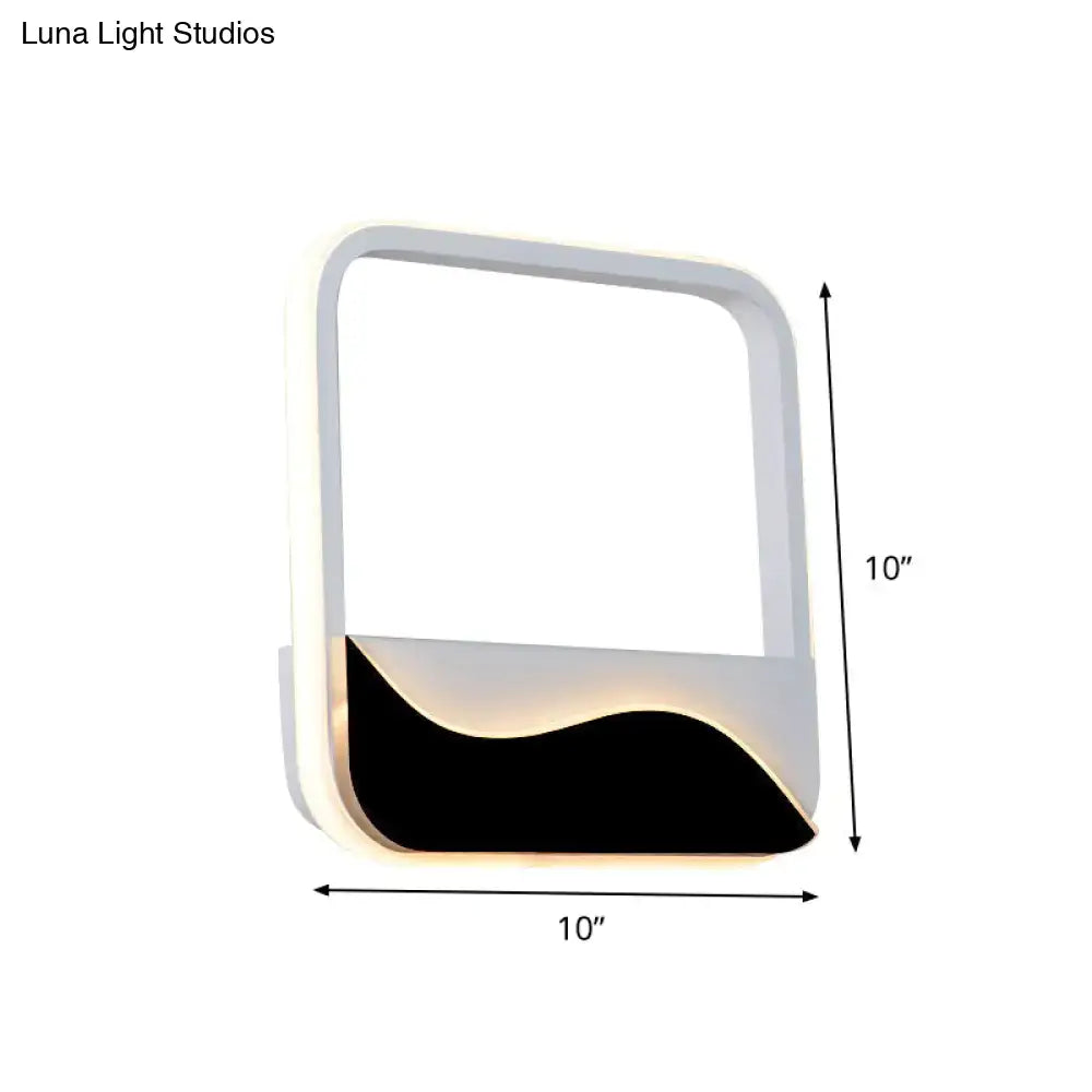 Black Wave LED Sconce by Decorbites; 10in square white frame with black wave base and warm glow on Tampa Home & Garden Store