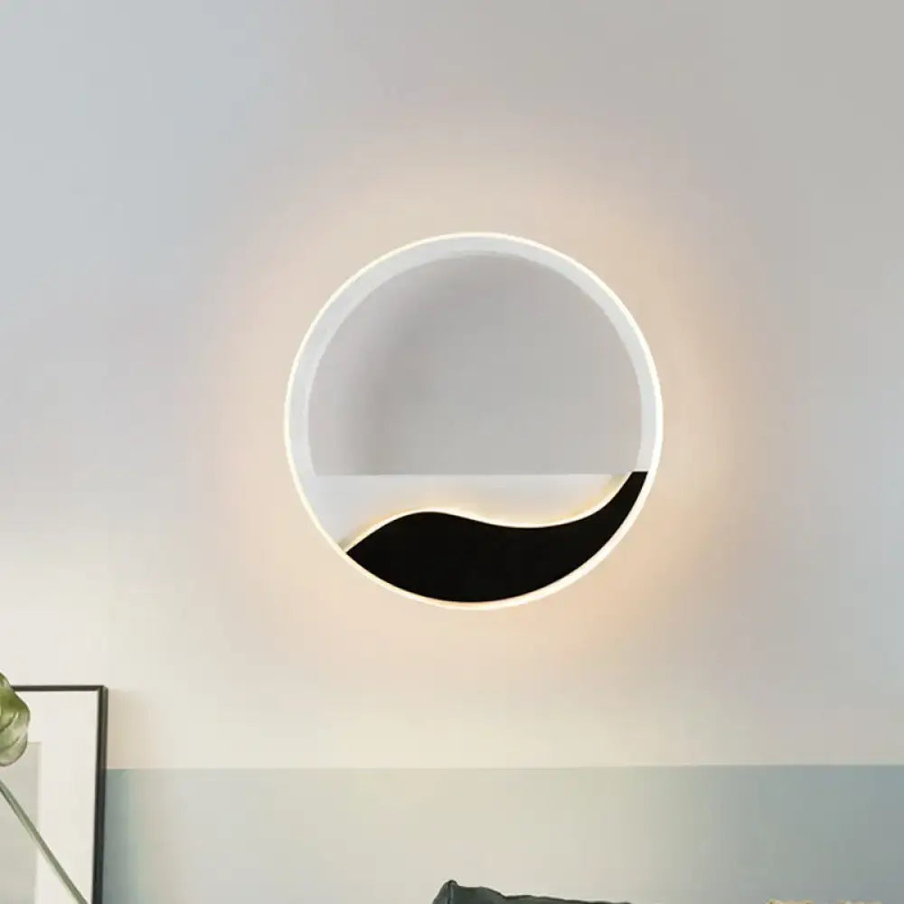 Black Wave LED Sconce by Decorbites, circular white wall light with black wave accent on Tampa Home & Garden Store