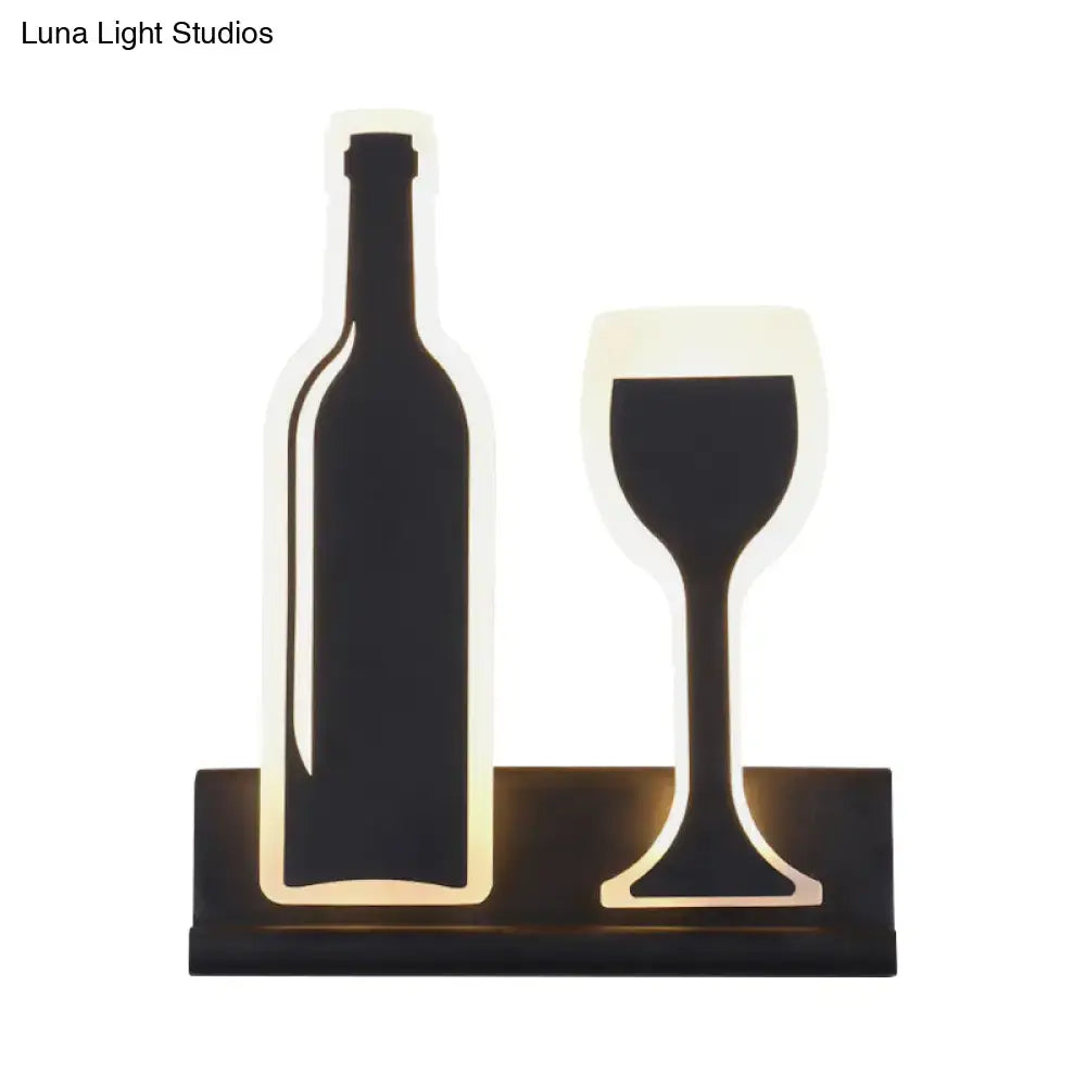 Black cast iron industrial sconce with illuminated bottle and wine glass motif Decorbites on Tampa Home & Garden Store