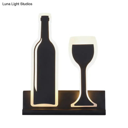 Black cast iron industrial sconce with illuminated bottle and wine glass motif Decorbites on Tampa Home & Garden Store