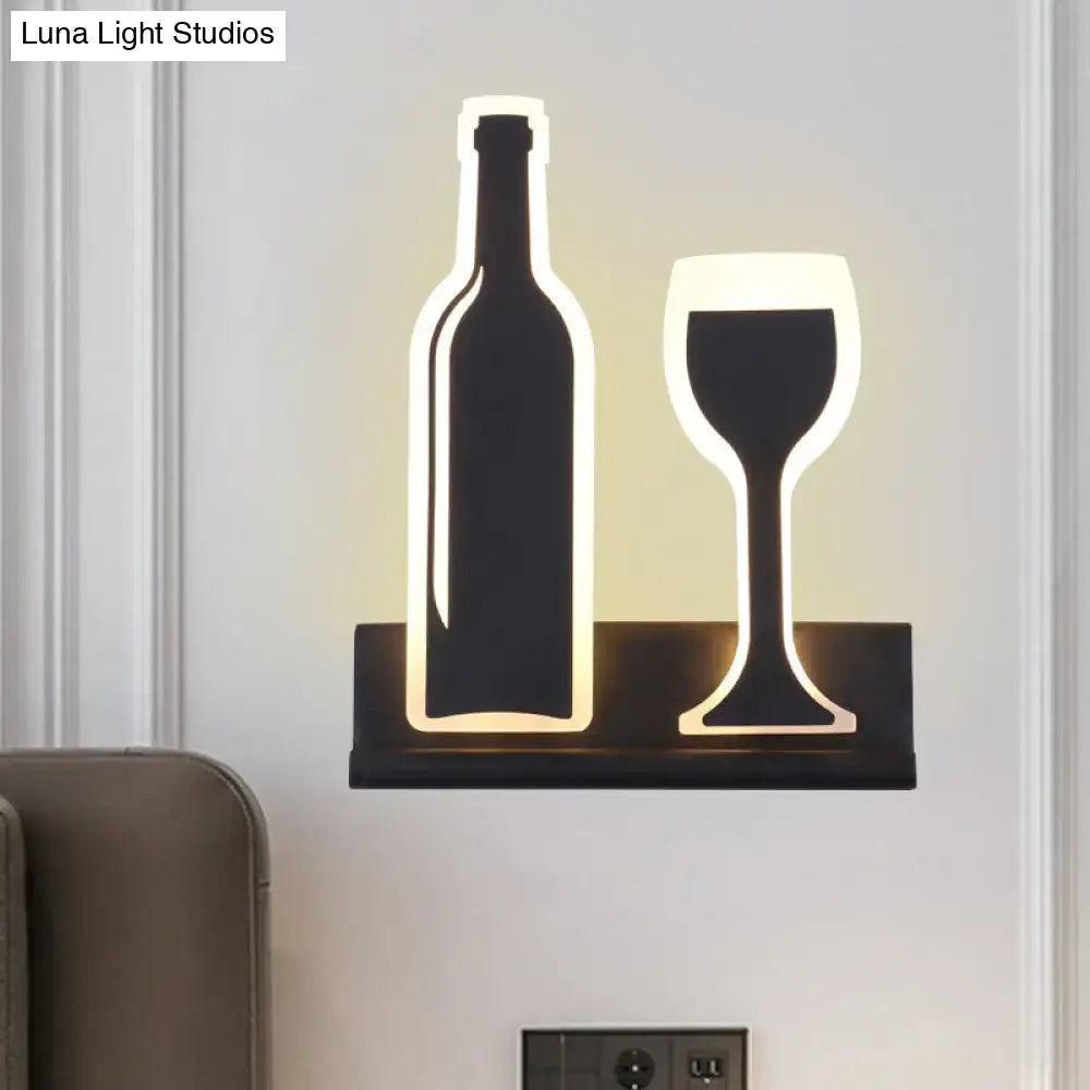Decorbites black cast-iron industrial sconce with two silhouettes bottle and wine-glass shapes on Tampa Home & Garden Store