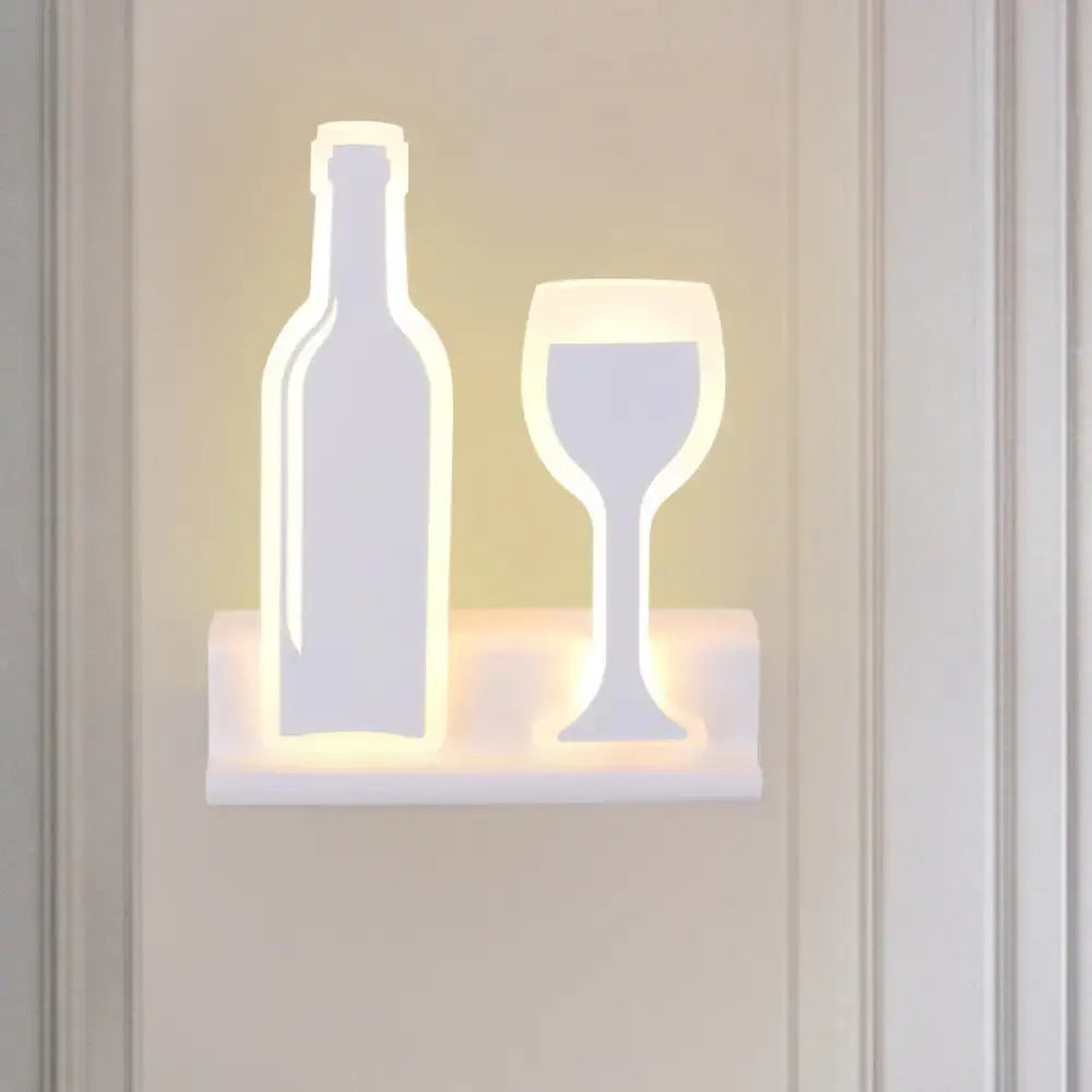 Black cast iron sconce with bottle and wine glass silhouettes, LED lighting on Tampa Home & Garden Store