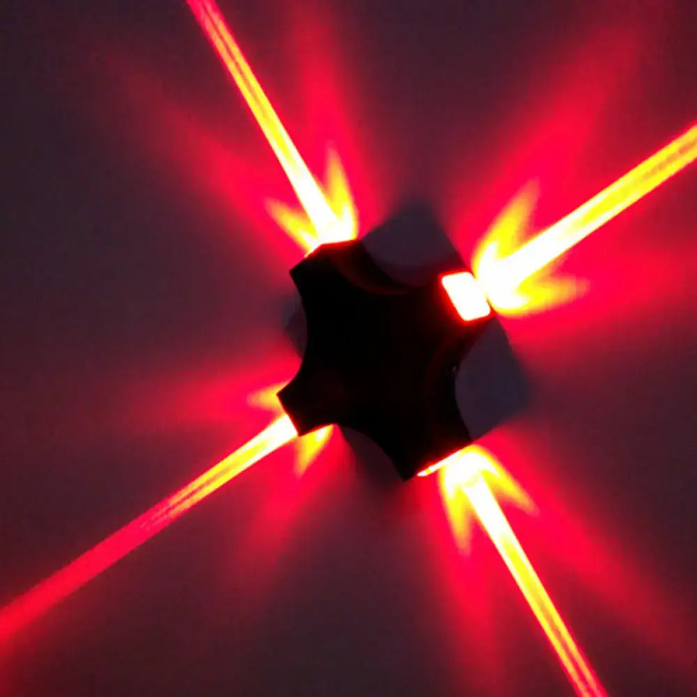 Black X LED wall sconce by Decorbites with red cross glow rays on Tampa Home & Garden Store