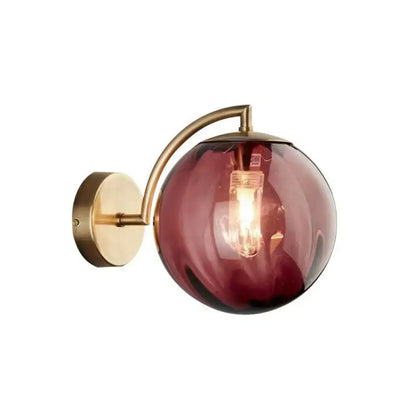 Gold brass bedroom wall sconce with burgundy ribbed glass globe and exposed bulb Decorbites on Tampa Home & Garden Store