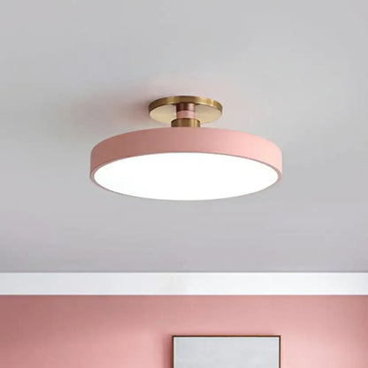 Round pink flush mount ceiling light with brass hardware by Decorbites for bedroom on Tampa Home & Garden Store