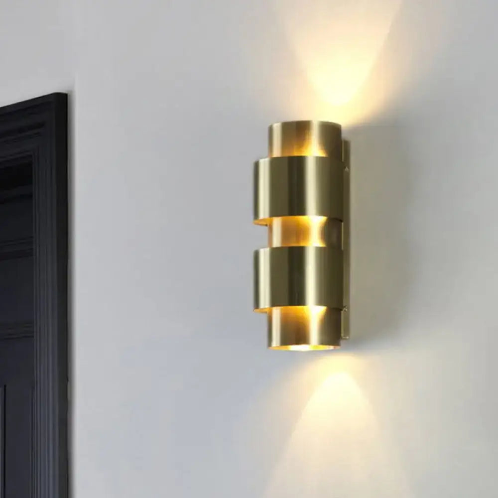 Brass Shade Sconce, stacked brass cylinders, warm glow on Tampa Home & Garden Store