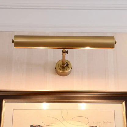 Brass adjustable vanity sconce with cylindrical bar, wall mount on Tampa Home & Garden Store