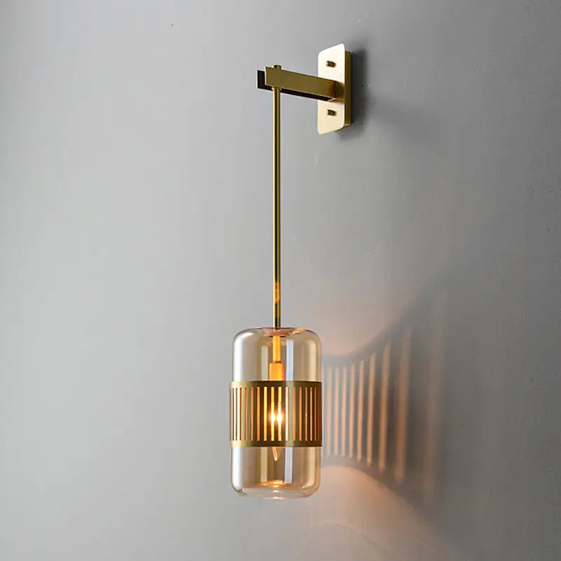 Amber glass cylindrical wall sconce with brass hardware by Decorbites on Tampa Home & Garden Store