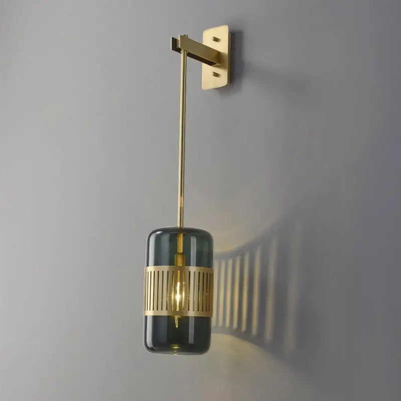 Decorbites amber glass cylindrical blackish green wall sconce with brass mount on Tampa Home & Garden Store