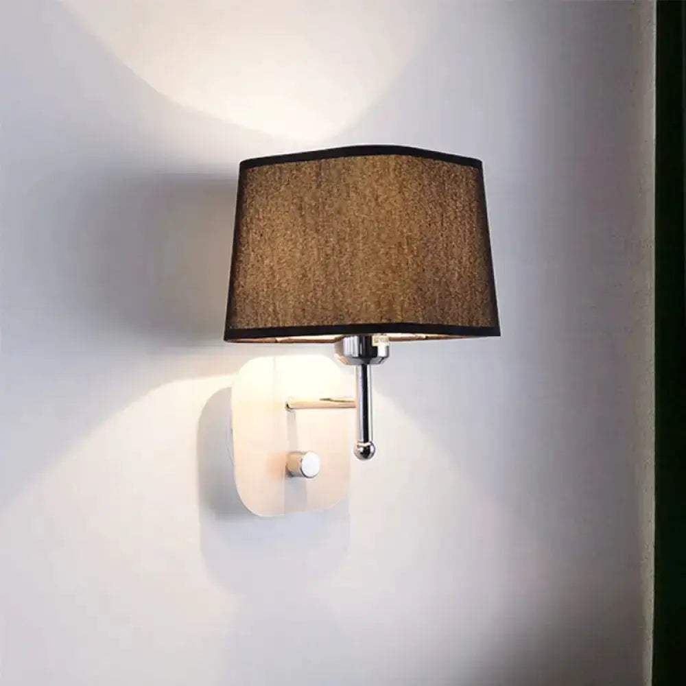 Wall sconce lamp in modern brass with beige linen shade, bedroom lighting on Tampa Home & Garden Store