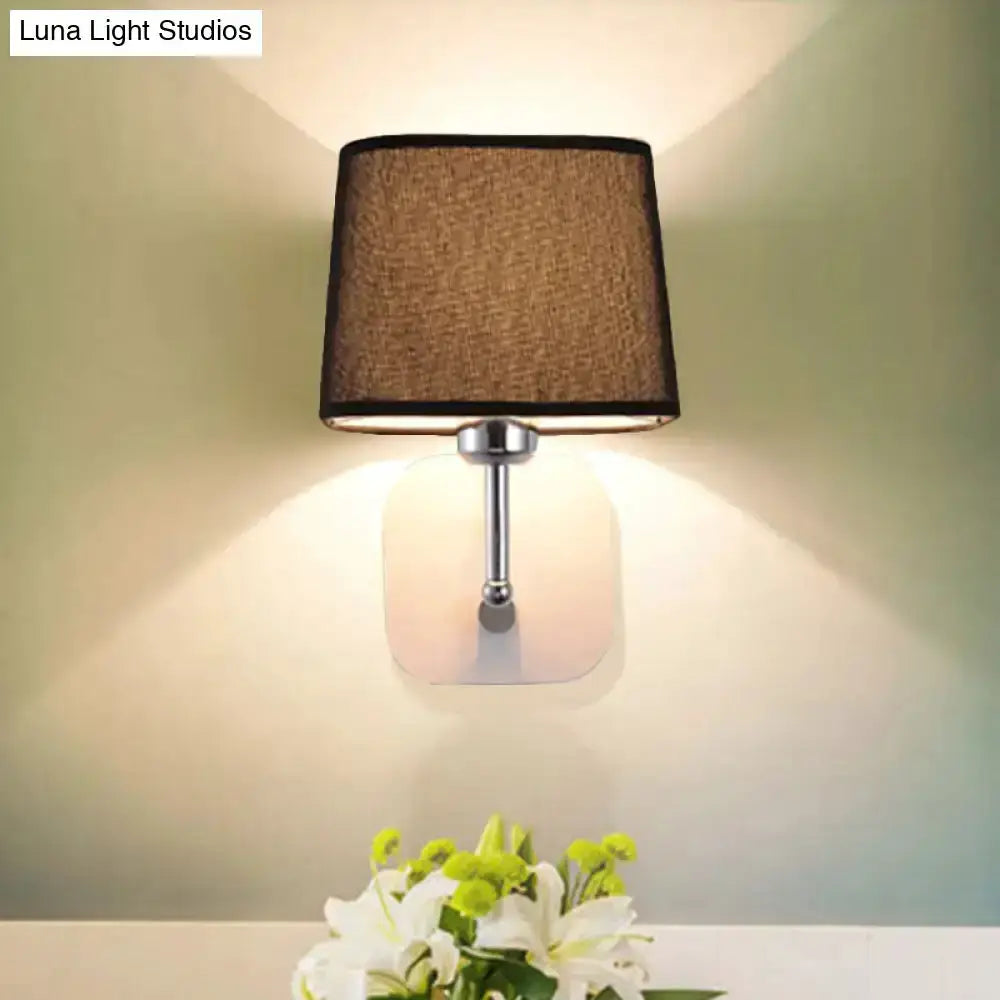 Modern brass and beige linen wall sconce by Decorbites with square backplate bedroom lamp on Tampa Home & Garden Store