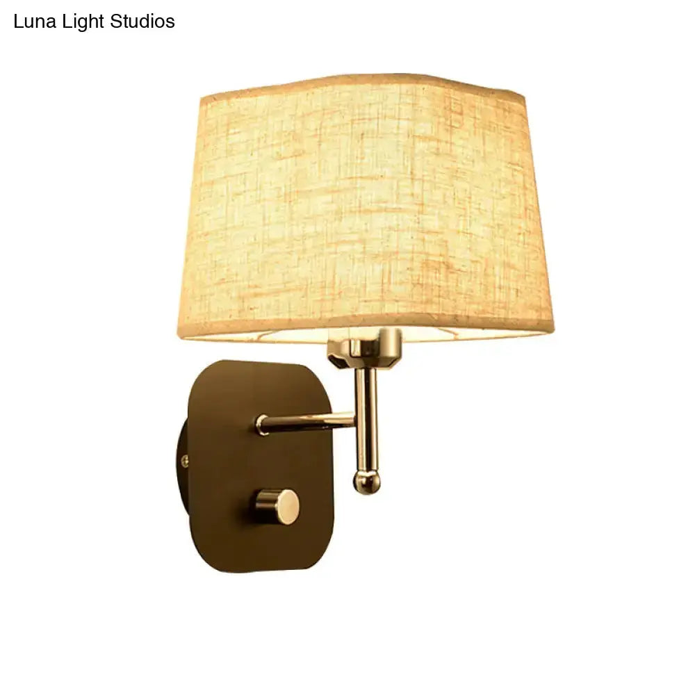 Brass wall sconce with beige linen shade by Decorbites for bedroom lighting on Tampa Home & Garden Store