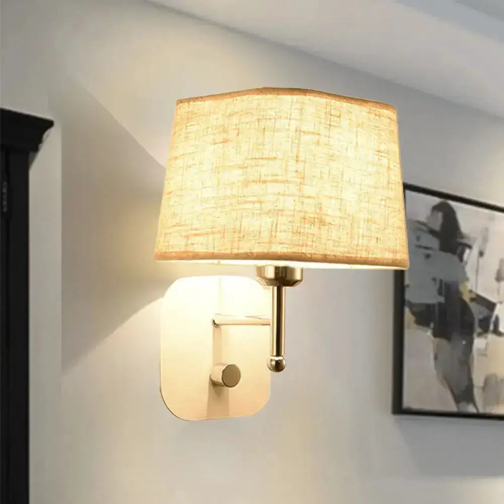 Brass and beige linen wall sconce with shade for bedroom lighting on Tampa Home & Garden Store