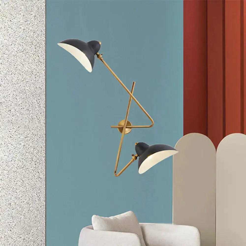 Duckbill wall sconce lamp by Decorbites in brass and black with dual arms on blue wall on Tampa Home & Garden Store