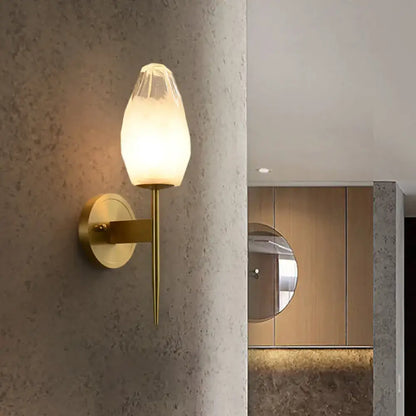 Brass glass post-modern wall sconce with frosted glass shade on round brass backplate on Tampa Home & Garden Store
