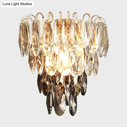 Crystal tiered wall sconce by Decorbites with gold-tone frame and hanging prisms on Tampa Home & Garden Store