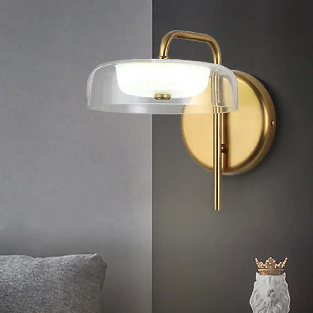 Decorbites brass glass 10-inch wall lamp with clear glass shade and round backplate on Tampa Home & Garden Store