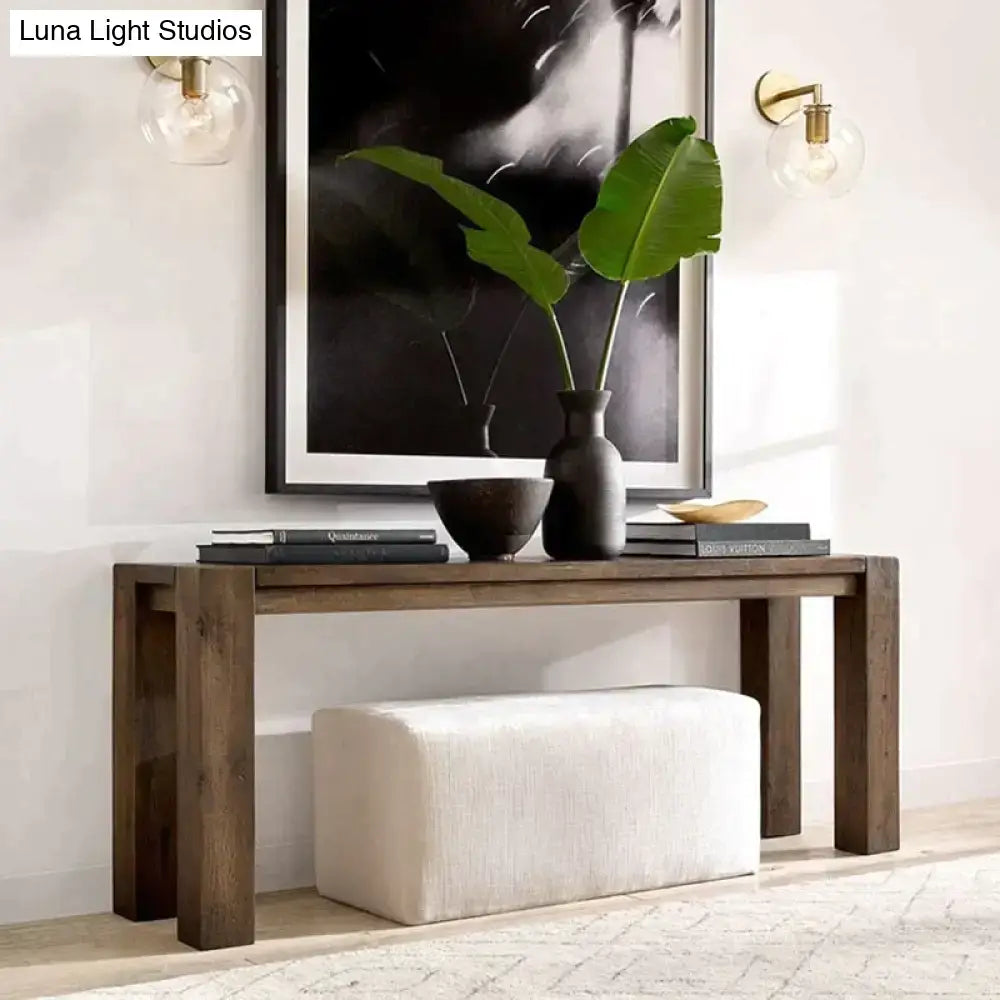 Brass Glass Wall Lamp pair with clear globe bulbs mounted as wall sconces on Tampa Home & Garden Store