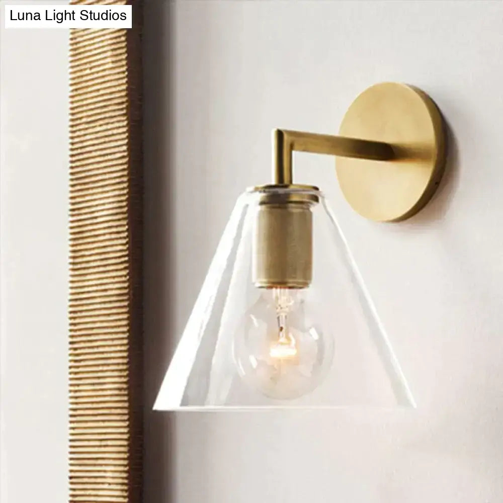 Brass Glass Wall Lamp with clear cone shade and exposed bulb on Tampa Home & Garden Store