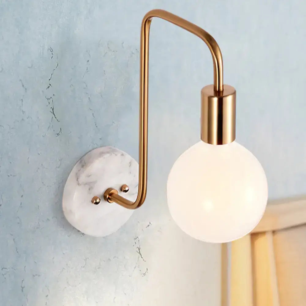 White glass sphere marble sconce with brass arc wall light on Tampa Home & Garden Store