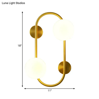 Milk Glass LED Sconce by Decorbites; brass arc frame with 2 frosted globes, 18in tall x 11in wide on Tampa Home & Garden Store