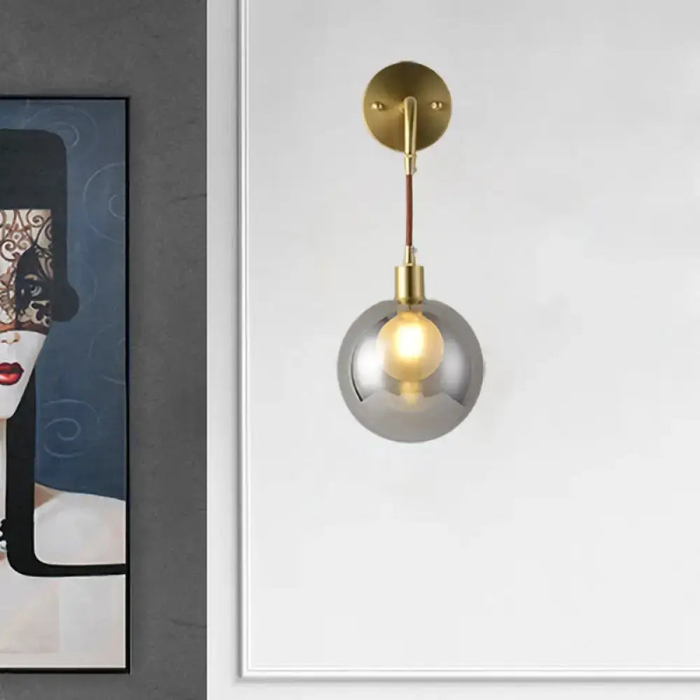 Brass Smoke Glass Sconce with smoked glass globe and brass hardware by Decorbites on Tampa Home & Garden Store