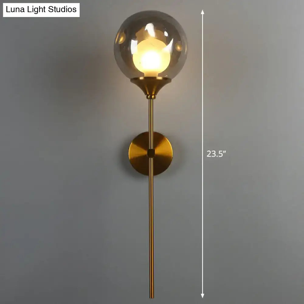 Brass Smoke Glass Wall Light by Decorbites; smoky glass globe, brass stem, 23.5in height on Tampa Home & Garden Store