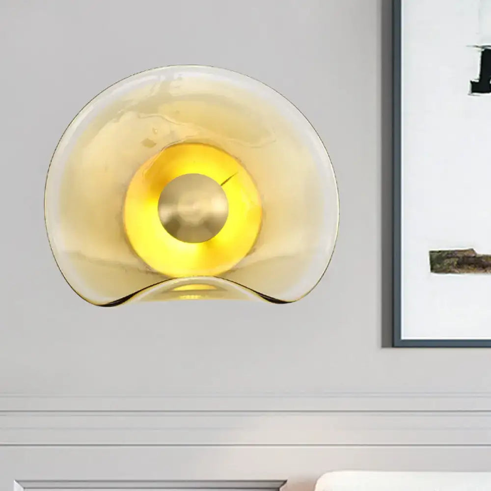 Brass Tan Glass Refined Sconce by Decorbites with warm amber glow on wall on Tampa Home & Garden Store