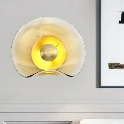 Brass Tan Glass Refined Sconce by Decorbites with warm amber glow on wall on Tampa Home & Garden Store
