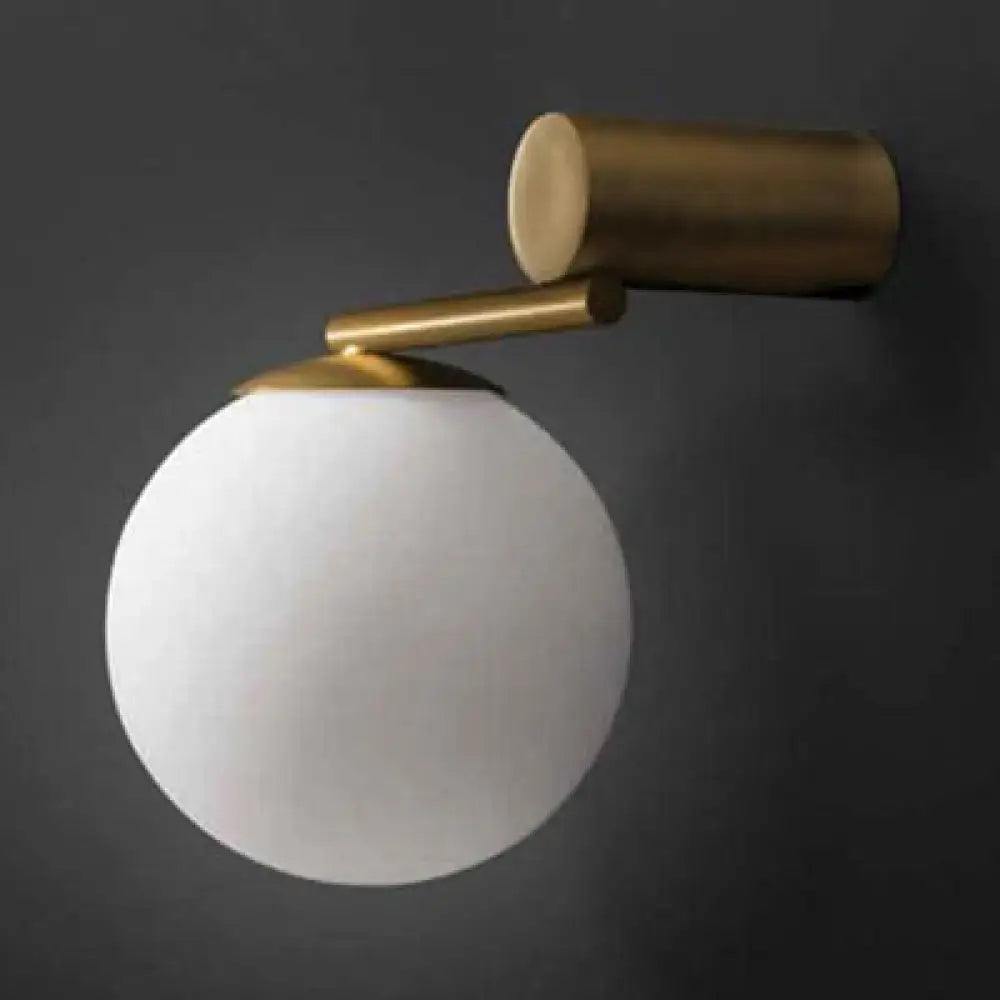 Brass Glass Sphere Wall Sconce with frosted white globe and gold arm on Tampa Home & Garden Store