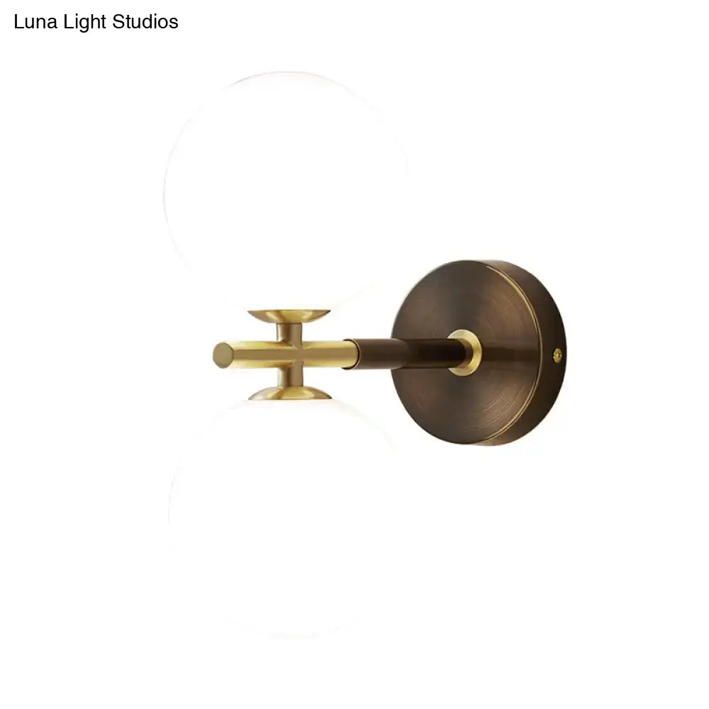 Brass and White Glass Globe Light Sconce