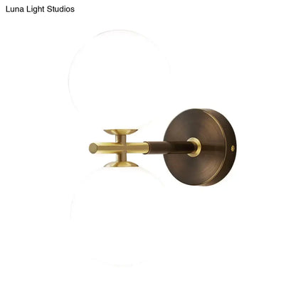 Brass and White Glass Globe Light Sconce