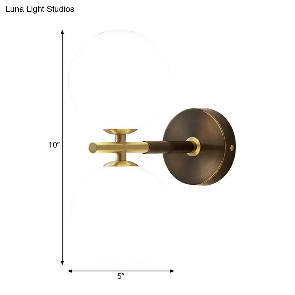 Brass Glass Globe Sconce by Decorbites, wall-mounted bronze backplate and clear glass globe on Tampa Home & Garden Store