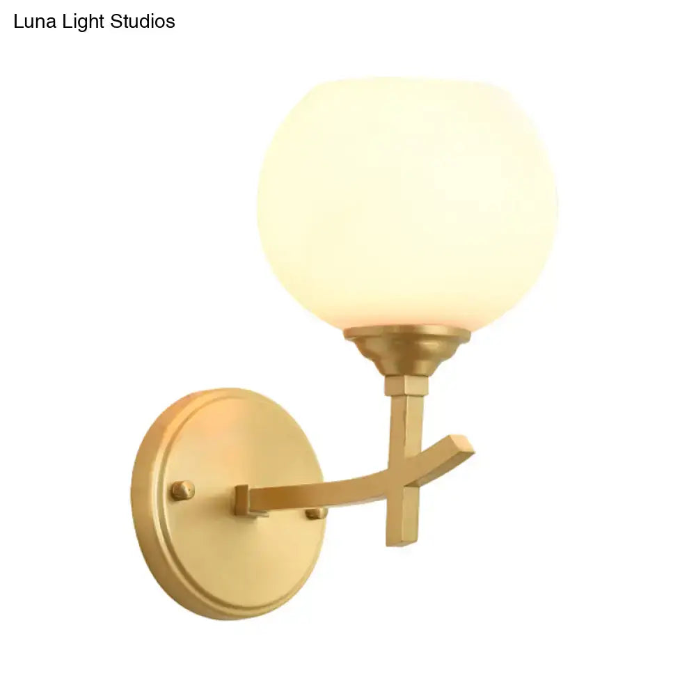 Decorbites brass opal glass wall sconce with round backplate and curved arm dual-mount style on Tampa Home & Garden Store