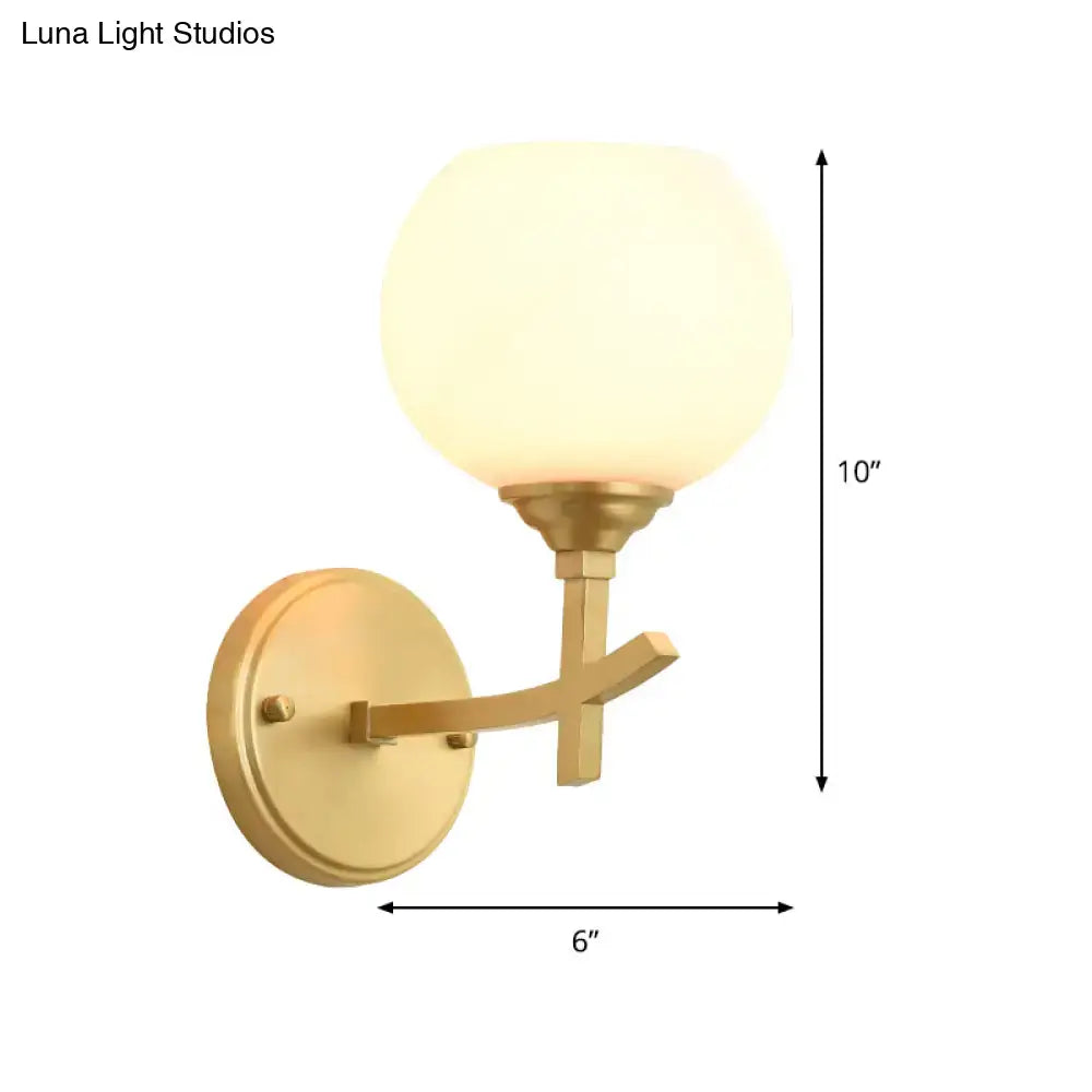 Brass opal glass wall sconce by Decorbites; dual-mount arm, 6-inch projection, 10-inch height on Tampa Home & Garden Store