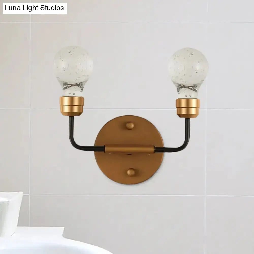Modern brass and black bulb-shaped wall sconce with two glass globe bulbs, Decorbites on Tampa Home & Garden Store
