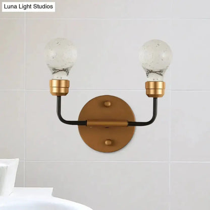 Modern brass and black bulb-shaped wall sconce with two glass globe bulbs, Decorbites on Tampa Home & Garden Store
