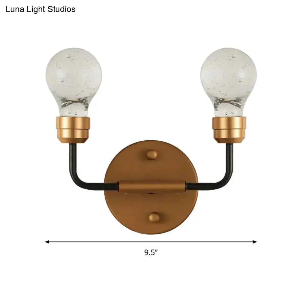 Two-light brass and black bulb-shaped bedroom sconce by Decorbites, wall-mounted fixture on Tampa Home & Garden Store