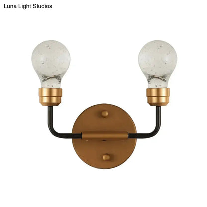 Modern brass and black dual bulb wall sconce by Decorbites with backplate and bubble bulbs on Tampa Home & Garden Store