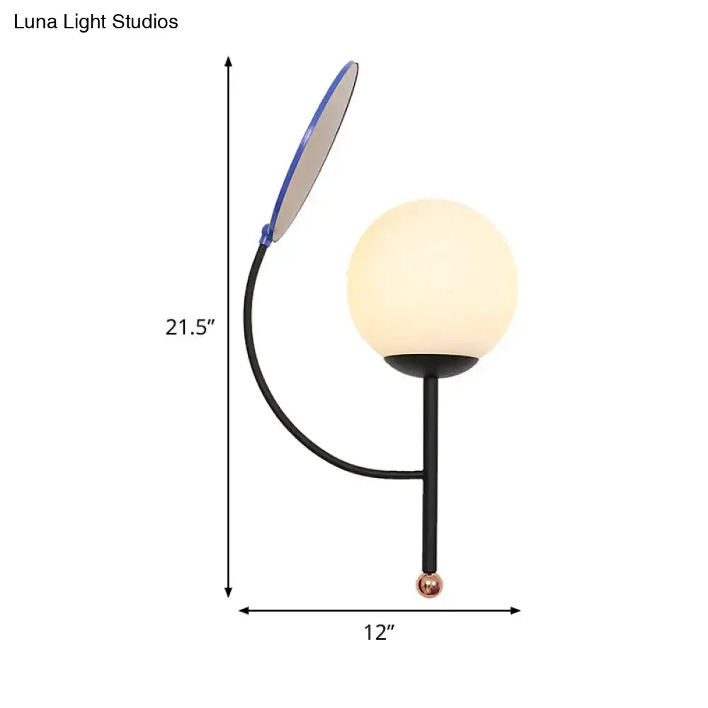 Brass Blue Frosted Sconce by Decorbites; curved black arm, frosted globe on Tampa Home & Garden Store