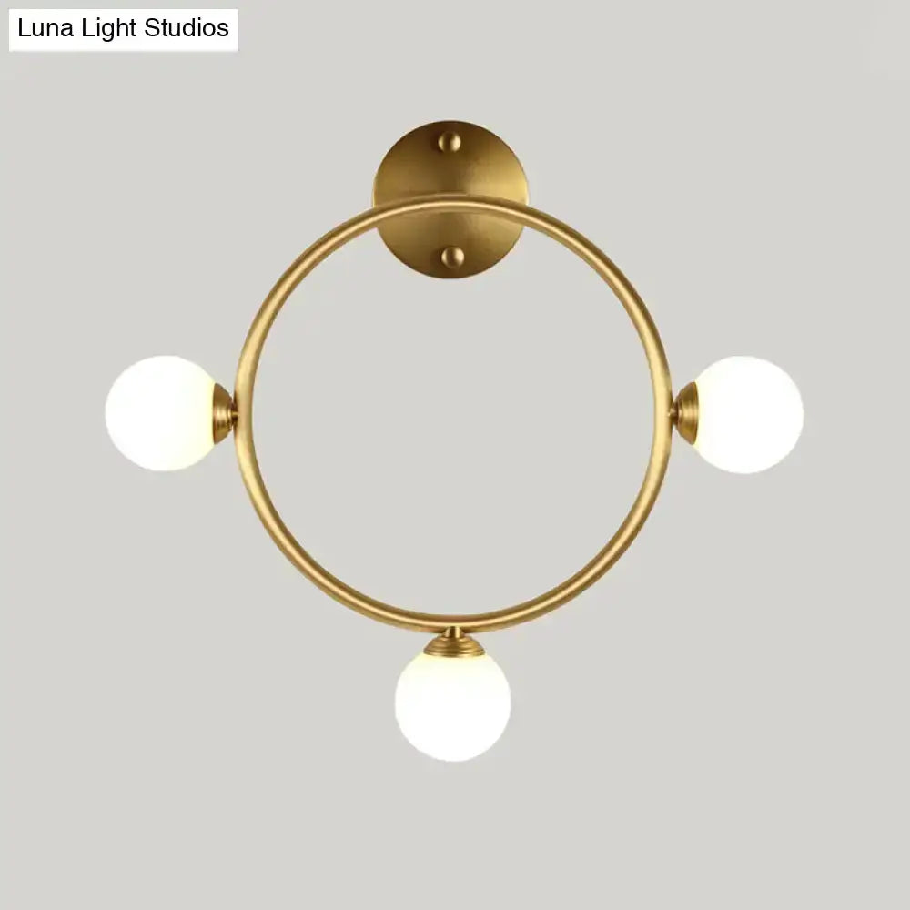 Modern brass circular wall light fixture with glass globe shades bedroom Decorbites on Tampa Home & Garden Store