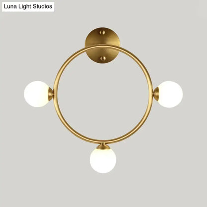 Modern brass circular wall light fixture with glass globe shades bedroom Decorbites on Tampa Home & Garden Store