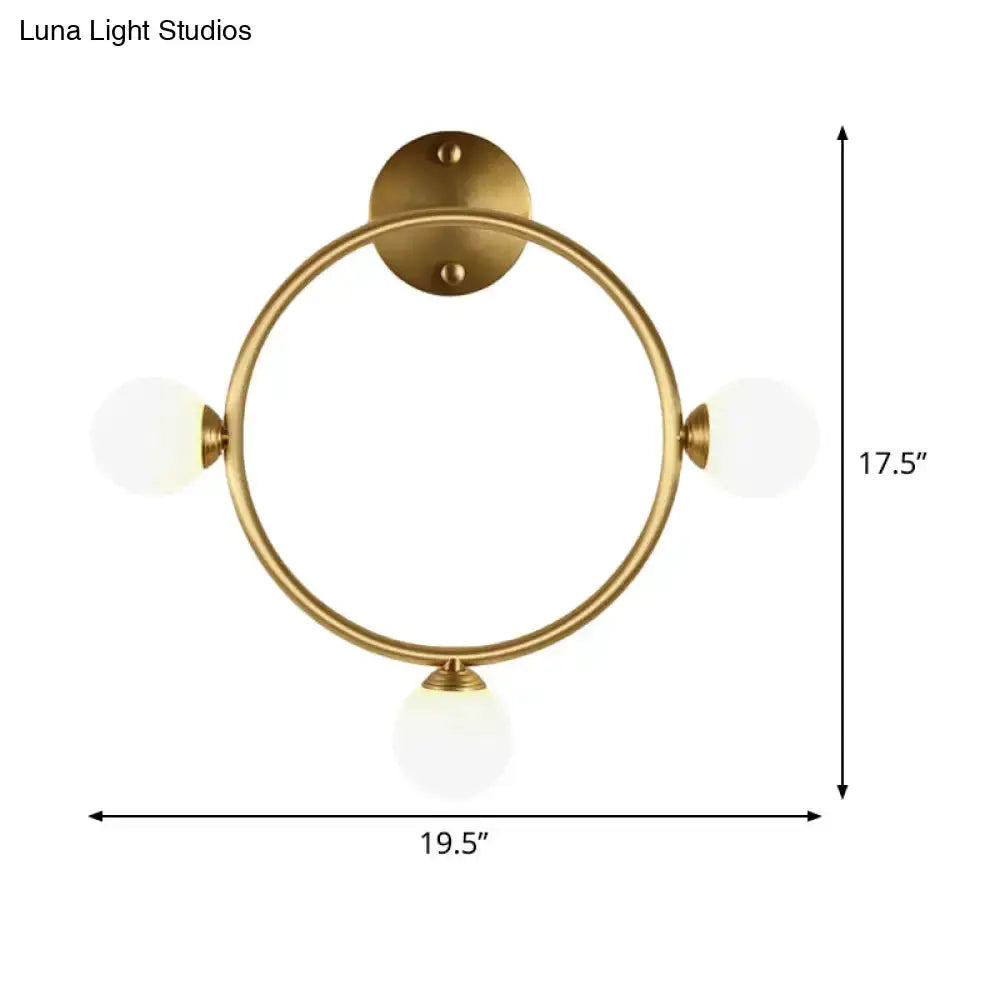 Modern brass circular wall light Decorbites with three glass globe shades 19.5 in wide on Tampa Home & Garden Store