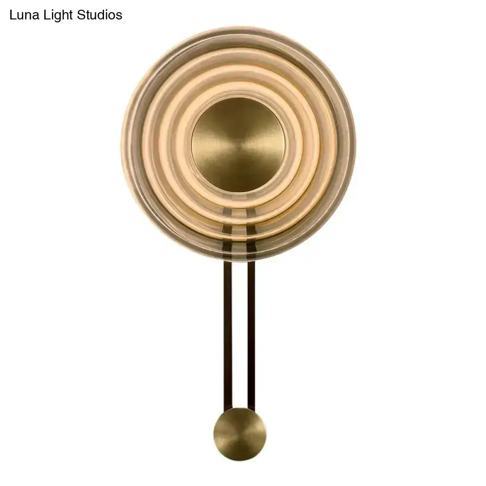 Modern brass concentric circle wall lamp by Decorbites with rings and brass accents on Tampa Home & Garden Store