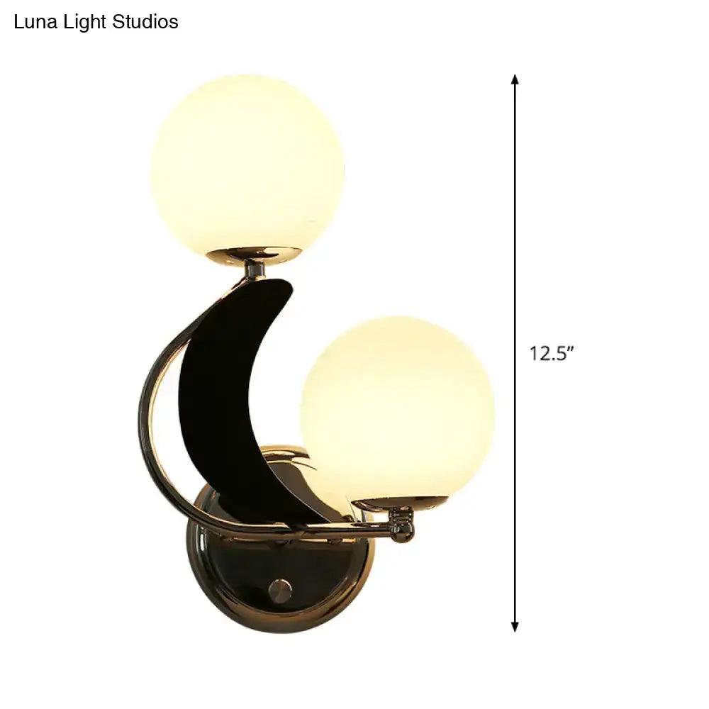 Modern brass crescent wall sconce with glass globe shades, double bulbs by Decorbites on Tampa Home & Garden Store