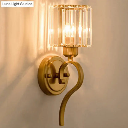 Crystal Cylinder Wall Sconce in warm brass with a faceted glass shade, wall mounted on Tampa Home & Garden Store