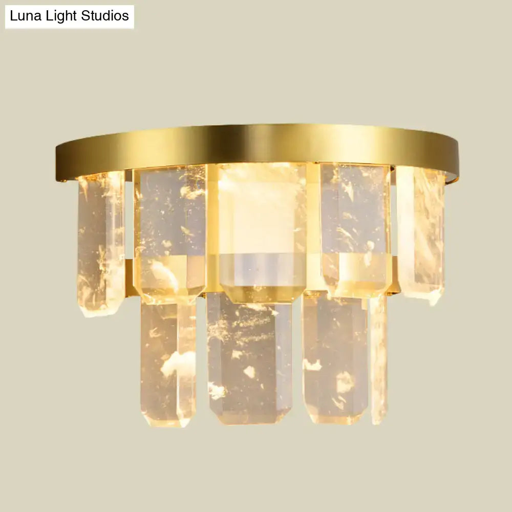 Brass crystal wall sconce with hanging rectangular prisms, warm gold finish on Tampa Home & Garden Store