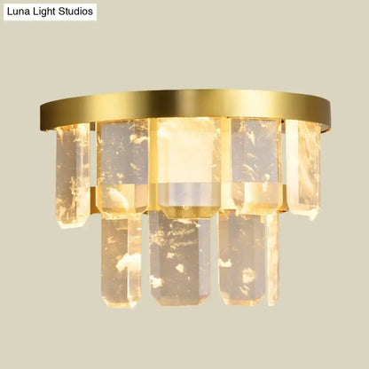 Brass crystal wall sconce with hanging rectangular prisms, warm gold finish on Tampa Home & Garden Store