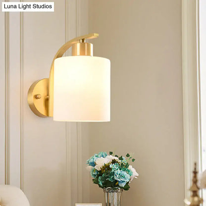 Brass milk glass direct-wired wall sconce with white cylindrical shade Decorbites on Tampa Home & Garden Store