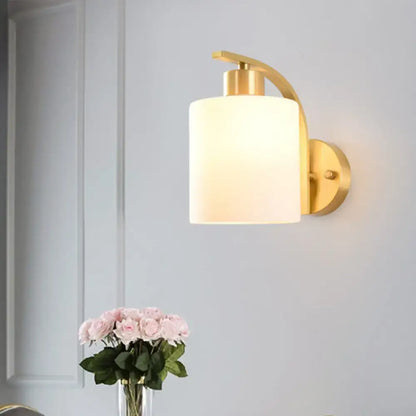 Brass milk glass direct-wired wall sconce with frosted shade by Decorbites on Tampa Home & Garden Store
